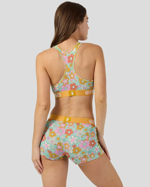 Modal two-piece set with colorful floral pattern, gold trim bands, and Playboy branding on back view.