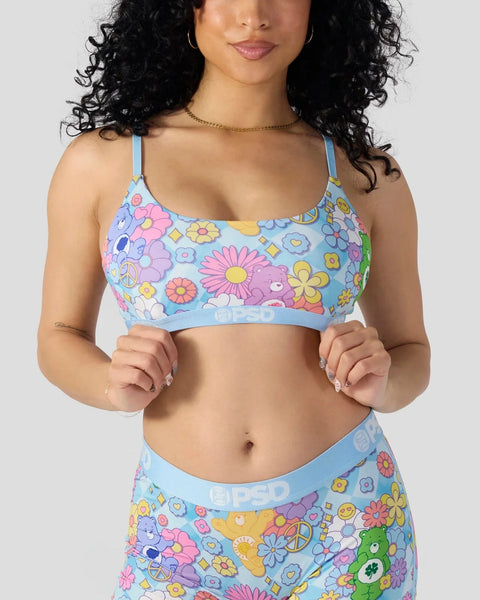 Light blue bra with multicolored Care Bears and flower print throughout.