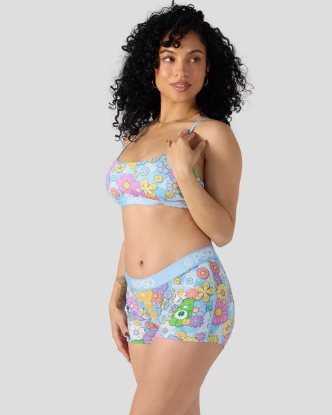 Light blue two-piece set with colorful flower and Care Bears character print throughout.