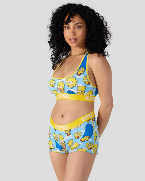 Two-piece swimwear set featuring yellow and blue cartoon character heads print with yellow waistband and trim.