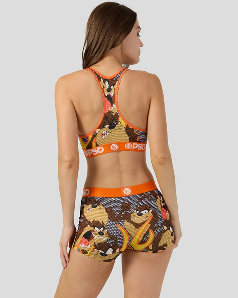 Taz Looney Tunes sports bra and shorts set with brown, yellow and orange Tasmanian Devil print and orange trim.