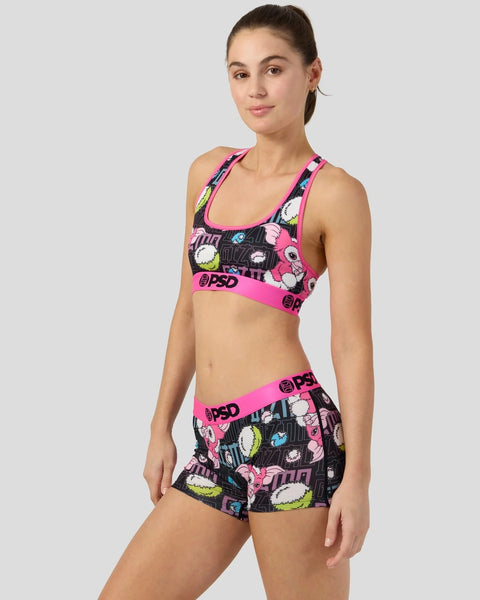 Sports bra and shorts set with black base, neon pink trim, and colorful cartoon character print throughout.