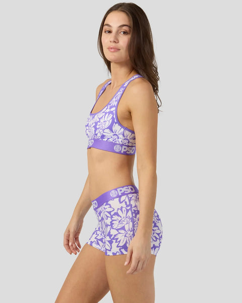 Purple and white floral sports bra and shorts set with branded waistband.