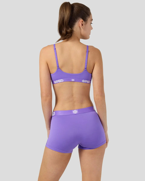 Purple sports bra and shorts set with branded waistband shown from back view.
