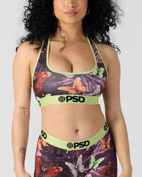 Women's sports bra and underwear set with purple butterfly print, neon green trim, and PSD branding.