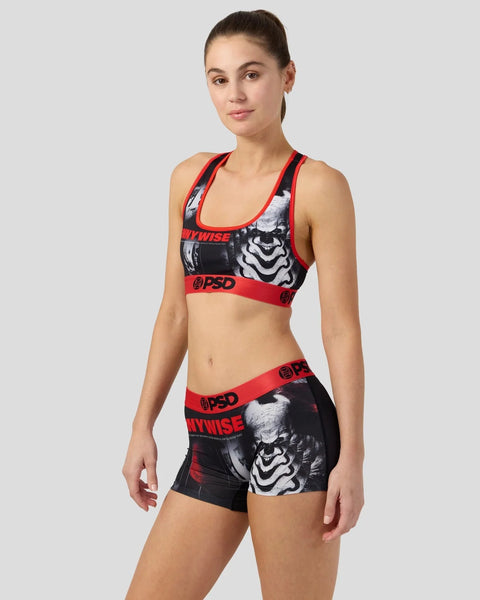 Women's sports bra and shorts set with red trim and black and white graphic print featuring 