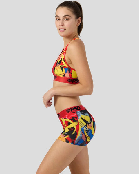 Woman wearing red and yellow Wolverine sports bra and boy shorts with character graphic print.