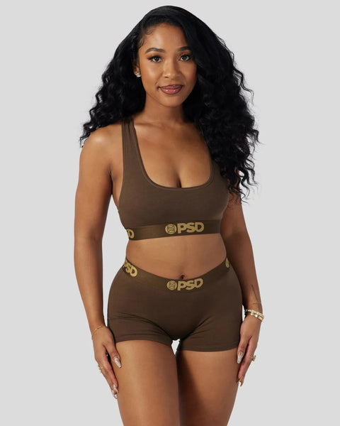 Brown modal sports bra and shorts set with gold PSD branding on elastic bands.