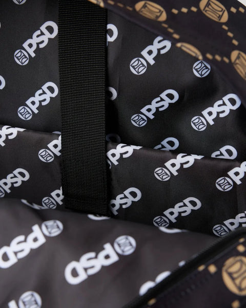 Black backpack with repeating white PSD logo pattern and black nylon straps visible.