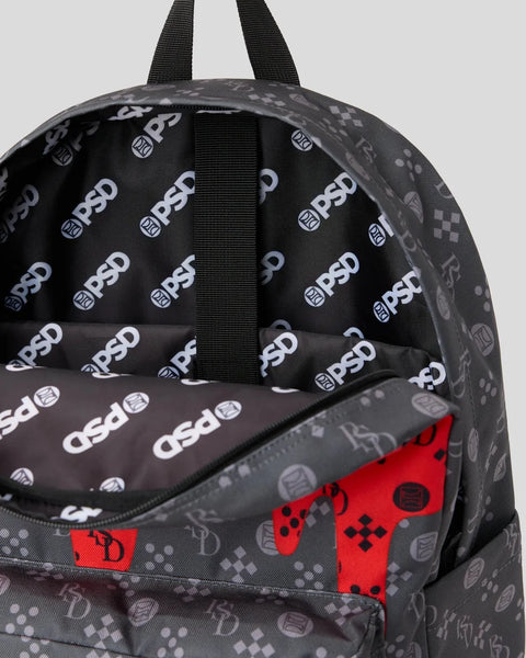 Black backpack with repeated logo pattern, black straps, and red gaming controller design on front pocket.