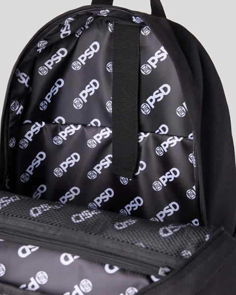 Black backpack with PSD branded interior lining, padded shoulder straps, and front zippered compartment.