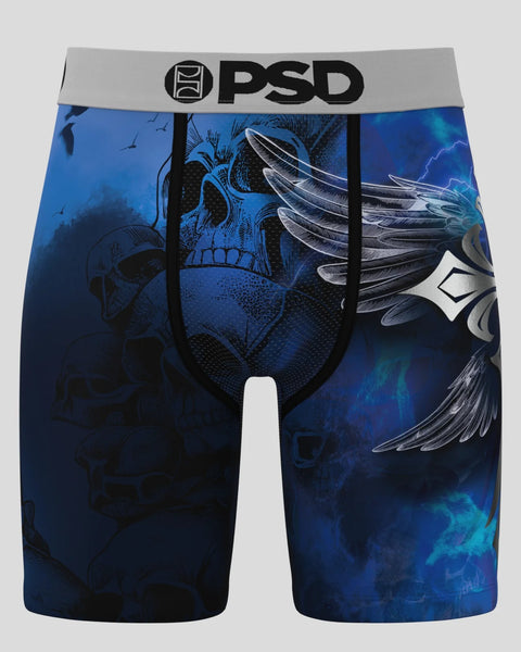 PSD brand men's boxer briefs with blue background featuring skull and wing graphic designs and gray waistband.