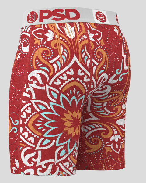 Red PSD boxer briefs with ornate floral and scroll pattern in white, gold, and turquoise.