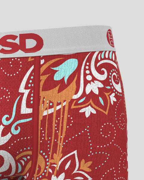 Red underwear with white, light blue, and gold ornamental scroll and floral pattern design on elastic waistband.