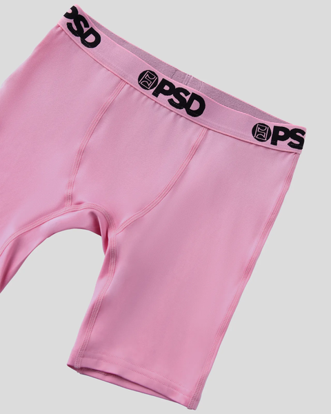 Pink boxer briefs with black PSD branding on elastic waistband.