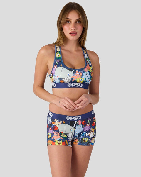 Woman wearing navy SpongeBob SquarePants sports bra and shorts set with character print and PSD branding.