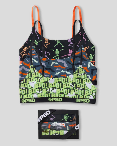 Three-pack of modal bralettes with skeleton and camouflage patterns, orange straps, and PSD branding on waistband.