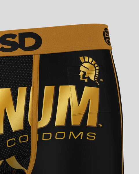 Black and gold Trojan Magnum XL condom packaging with waistband detail and Trojan logo visible.