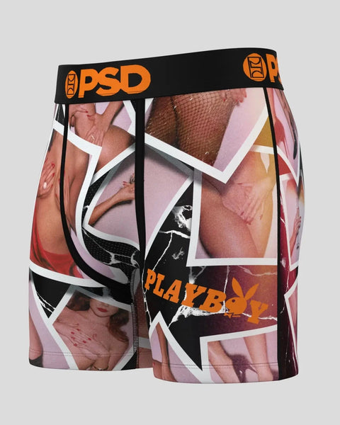 PSD boxer shorts with black waistband featuring Playboy polaroid-style photo collage print in pink, red, and orange tones.