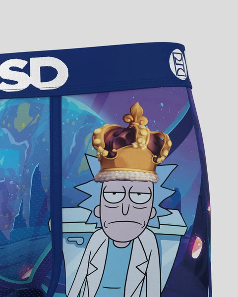 Rick and Morty character wearing a gold crown on navy blue boxer briefs with colorful background graphics.