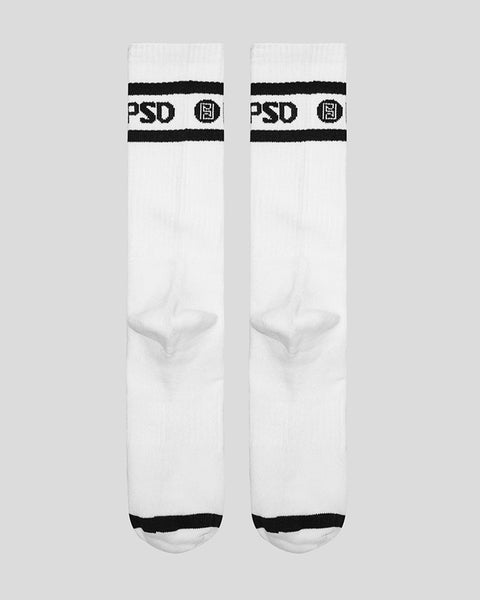White crew socks with black stripes and PSD logo branding at calf.