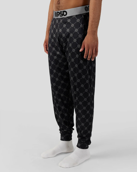 Black lounge pant with repeating circular logo pattern and gray elastic waistband.