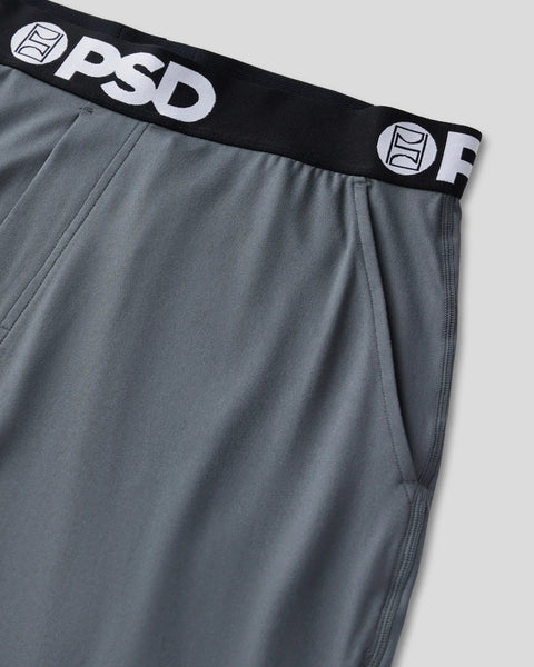 Charcoal lounge pant with black elastic waistband featuring white PSD branding and logo details.