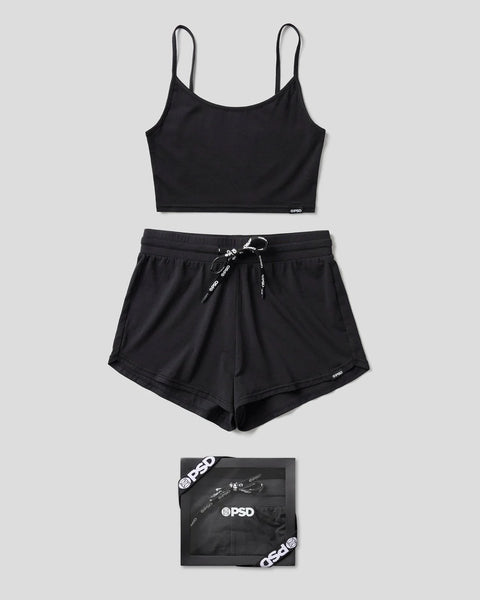 Black modal cami sleep set with thin straps, scoop neckline top, and matching shorts with drawstring waistband.