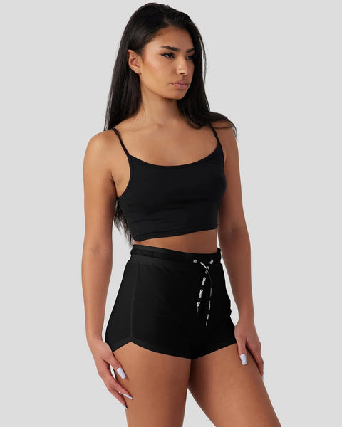 Black modal cami sleep set with thin straps and drawstring shorts on model.