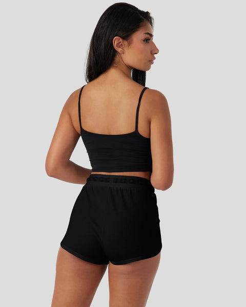 Black modal cami crop top and shorts sleep set shown from back view on model.