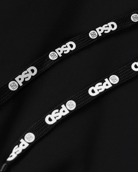 Black modal fabric with white PSD branded waistband elastic straps visible on dark background.