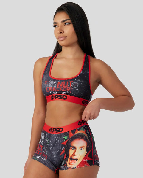 Woman wearing black and red sports bra and shorts set with 