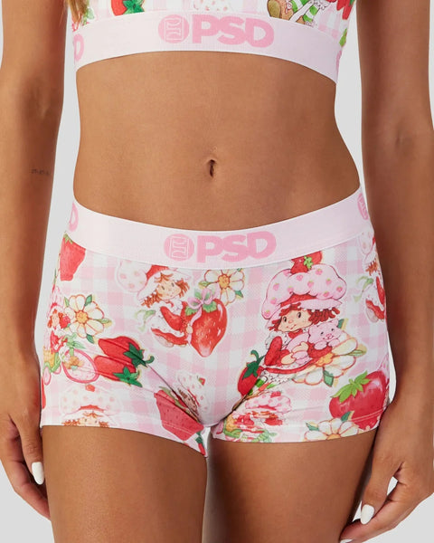White PSD underwear with strawberry, flower, and character print and elastic waistband.