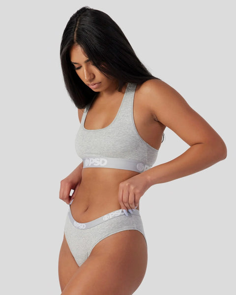 Grey athletic bra and brief set with branded elastic waistbands.
