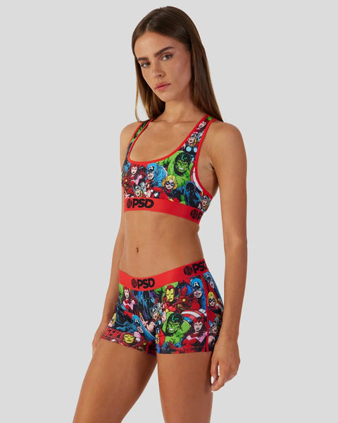 Women's sports bra and shorts set featuring Avengers character graphics on red fabric with branded waistband.