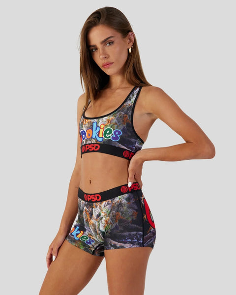 Woman wearing two-piece athletic set with colorful floral print, 
