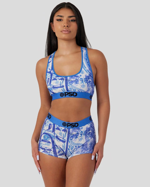 Blue and white paisley sports bra and shorts set with branded elastic waistband.