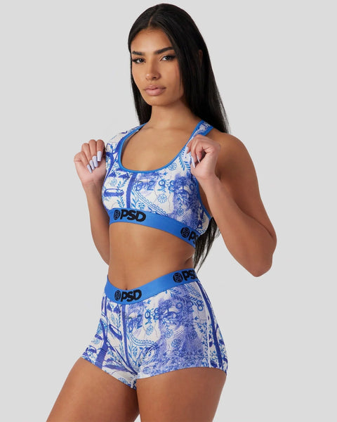 Blue and white paisley patterned sports bra and shorts set with blue elastic waistbands.