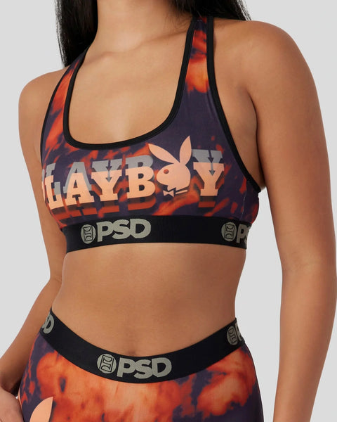Playboy racerback sports bra with red and black lava dye print, Playboy logo, and PSD waistband.