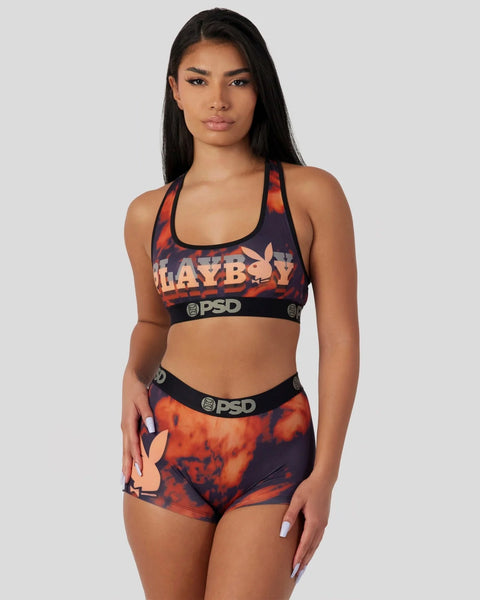 Playboy lava dye two-piece set with red and black tie-dye pattern, featuring logo print and PSD waistband.