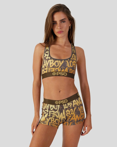 Gold and brown graffiti-print sports bra with matching shorts featuring Playboy branding and side lacing.