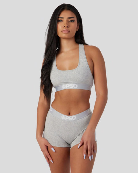 Light grey racerback sports bra and matching boy shorts with branded waistbands.