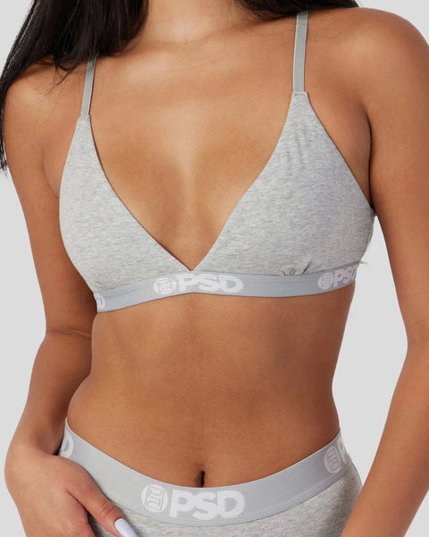 Grey athletic bra with adjustable straps and matching grey briefs with branded waistband.
