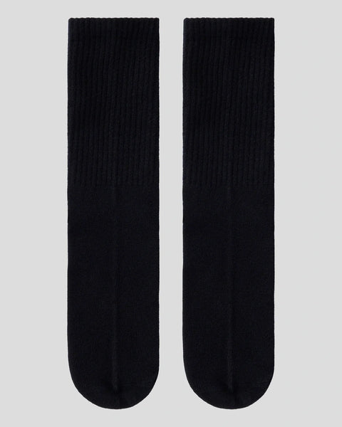 Pair of black ribbed crew socks with rounded toe and heel sections.