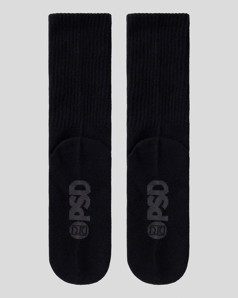 Pair of black ribbed crew socks with tonal logo graphic on the foot.