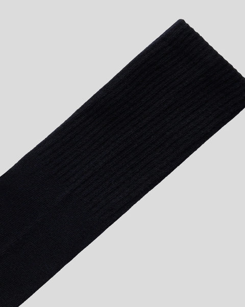Black ribbed crew neck sweater with textured knit fabric.