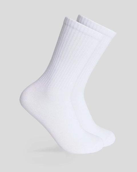 Pair of white ribbed crew socks with cushioned sole, displayed on gray background.