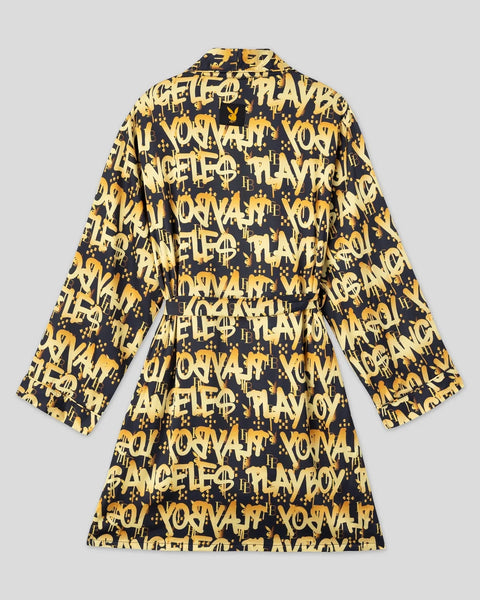Black and gold graffiti-print shirt dress with long sleeves and collar, displayed flat on gray background.