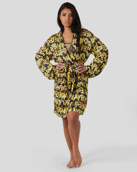 Yellow and black graffiti-print robe with long sleeves and tie waist closure.