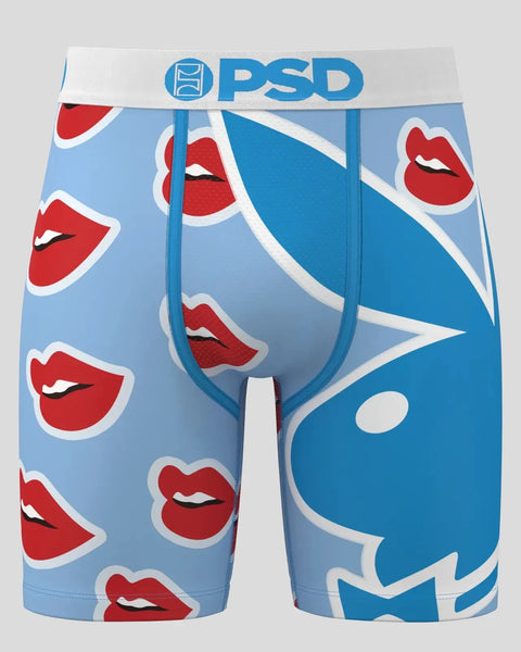 PSD brand men's boxer briefs with red lip print and blue abstract design on light blue background.